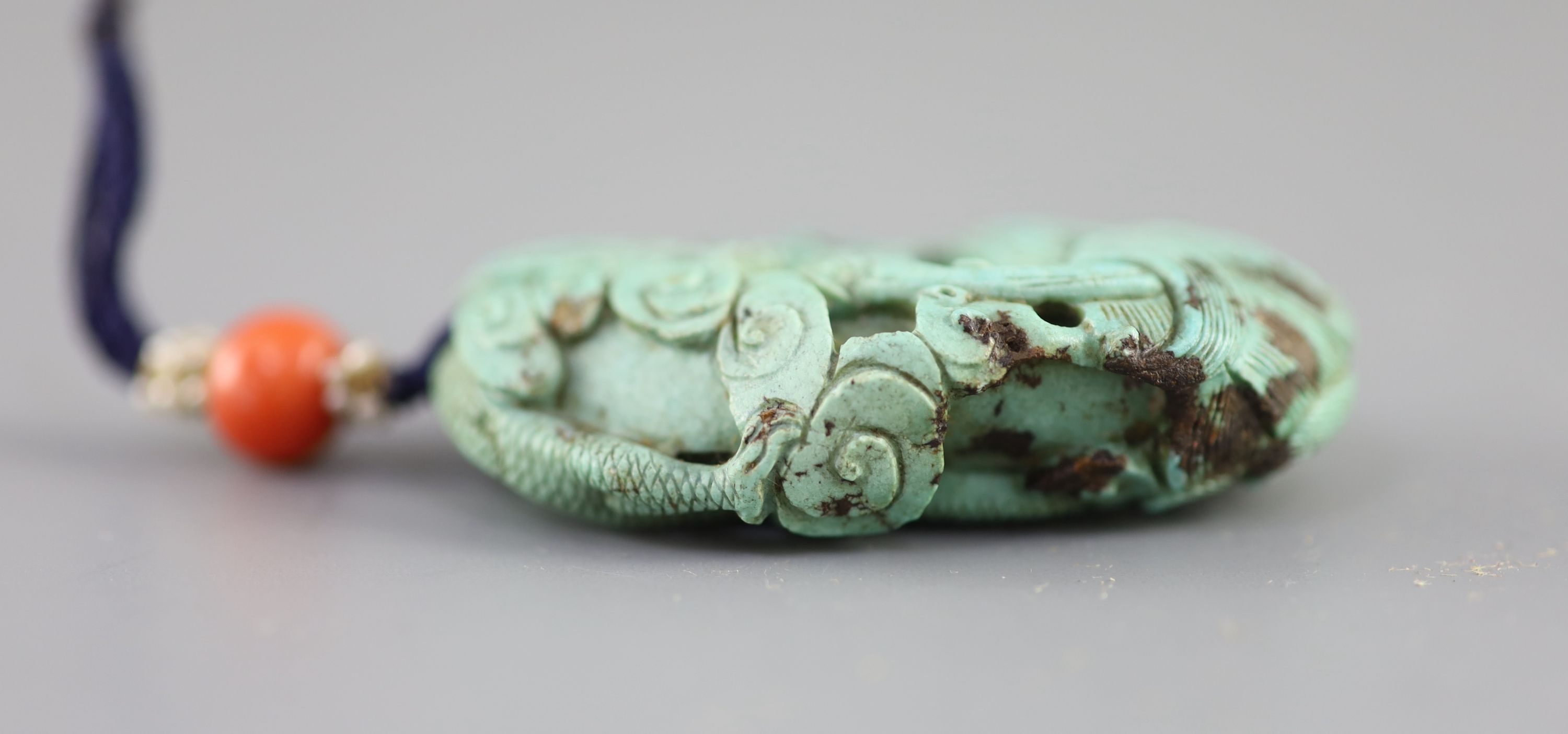 A Chinese turquoise matrix ‘dragon’ pendant, 19th century 5.4cm long